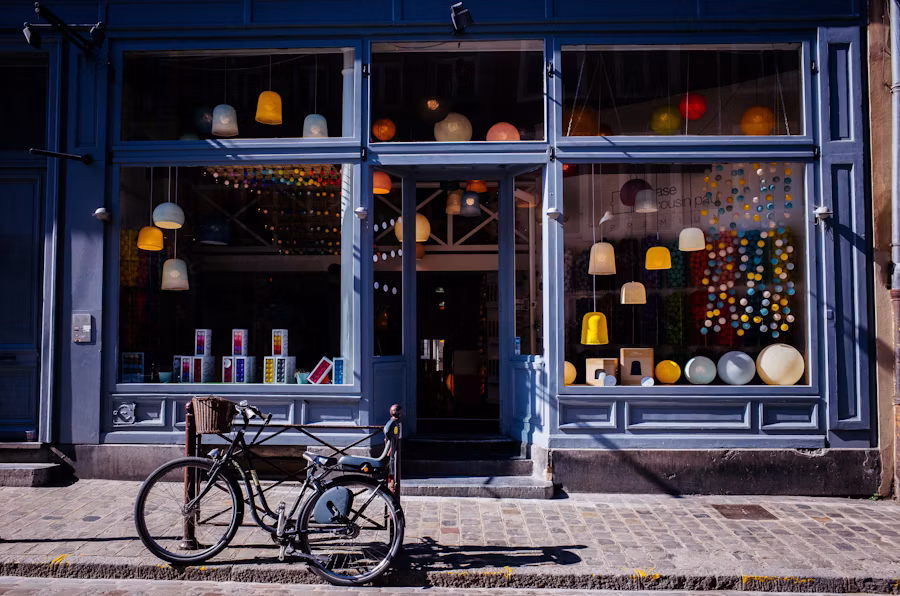 Small storefront shop front with a bicycle outside