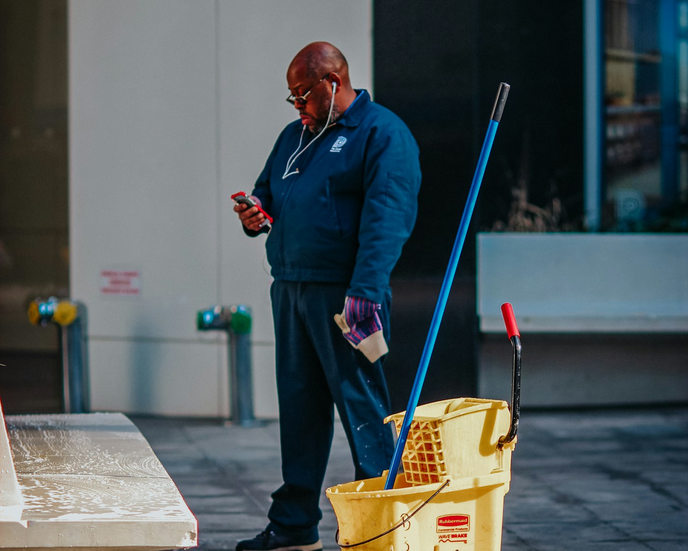 Cleaning business owner checking phone for a quote text, helped by a virtual assistant for cleaning business