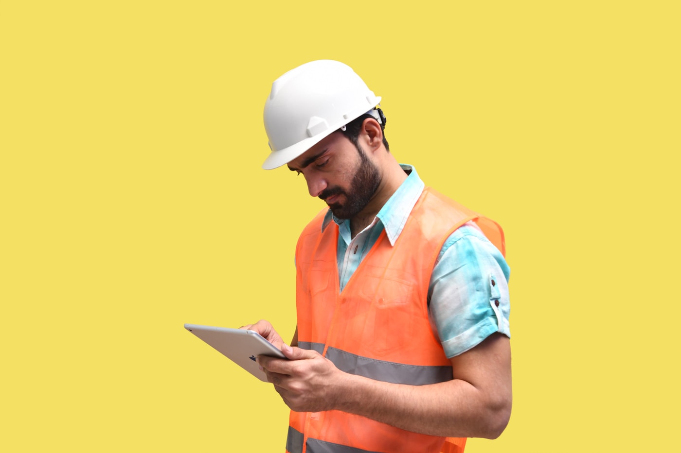 Contractor on a job site checking messages from a virtual assistant for contractors