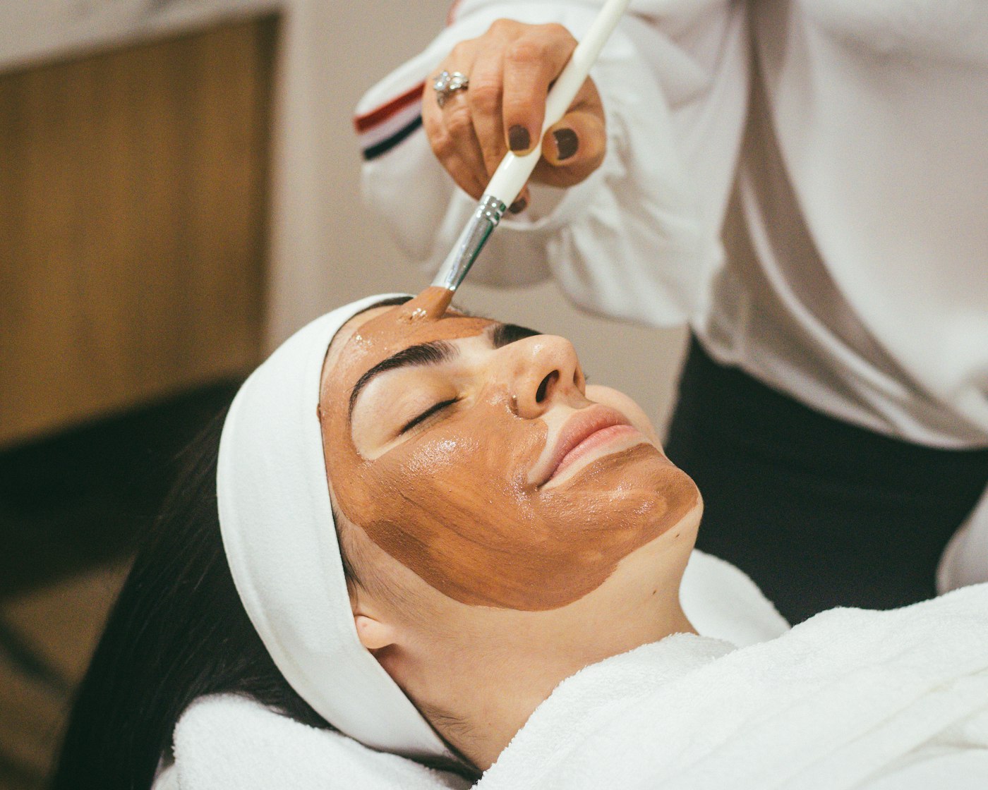 Esthetician applying a facial treatment, virtual assistant for estheticians